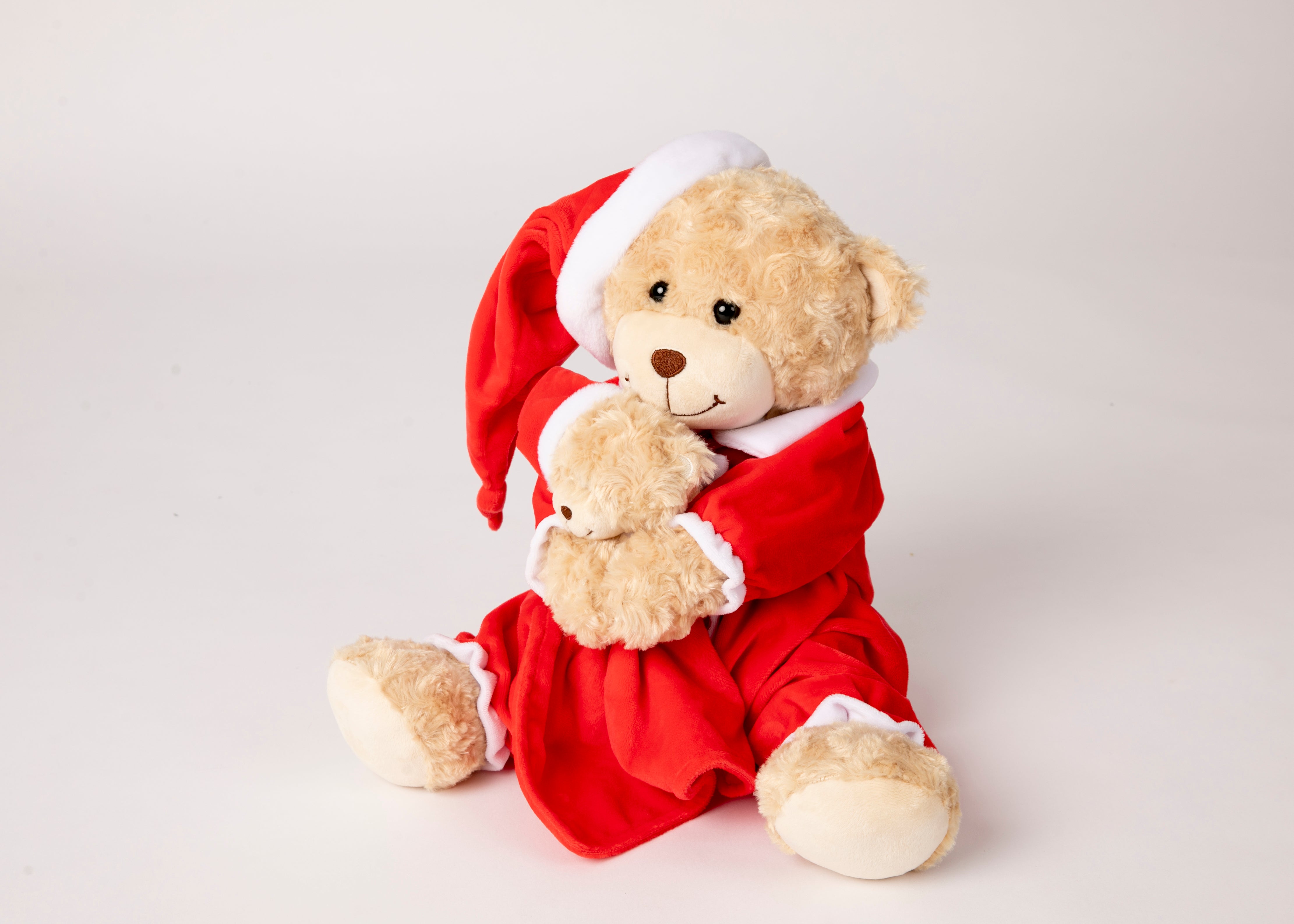 White robe and Red & white striped Christmas pyjamas & Teddy and comfortor & Gift box